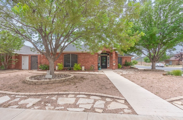 ranch-style house with brick siding