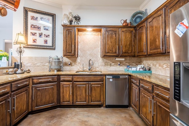 kitchen featuring backsplash, appliances with stainless steel finishes, and a sink