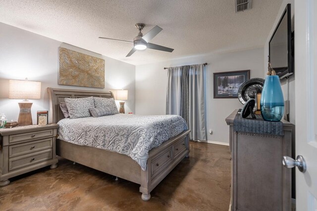 bedroom with concrete flooring, a ceiling fan, a textured ceiling, and visible vents