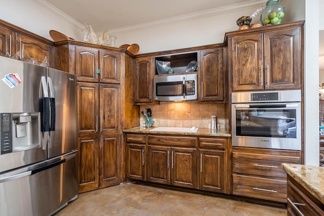 kitchen with crown molding, light stone counters, decorative backsplash, concrete flooring, and stainless steel appliances
