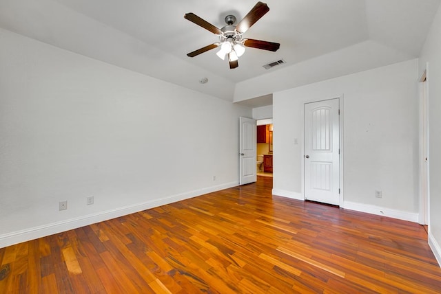 unfurnished bedroom featuring baseboards, visible vents, ceiling fan, and hardwood / wood-style floors