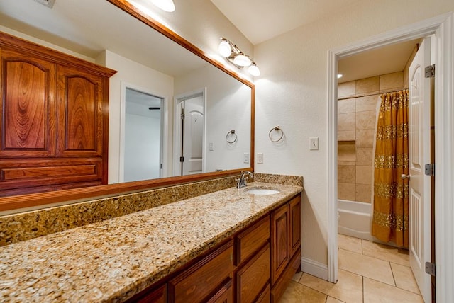 full bathroom with tile patterned flooring, shower / tub combo with curtain, vanity, and baseboards