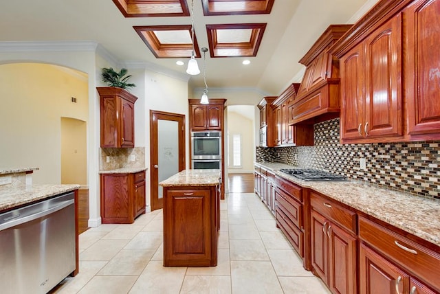 kitchen with light tile patterned floors, appliances with stainless steel finishes, backsplash, light stone countertops, and crown molding