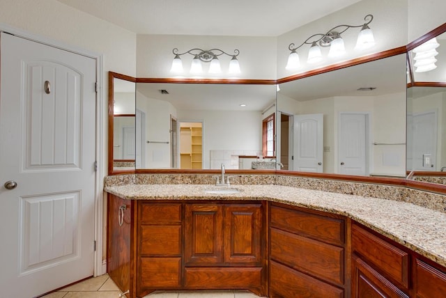 bathroom featuring visible vents, a closet, vanity, and tile patterned floors