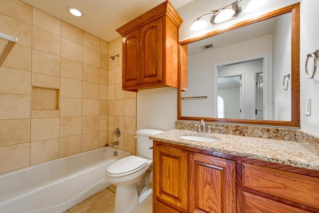 bathroom featuring bathtub / shower combination, visible vents, toilet, vanity, and tile patterned flooring