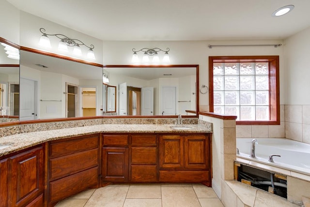 full bath featuring tile patterned floors, a garden tub, a sink, and double vanity