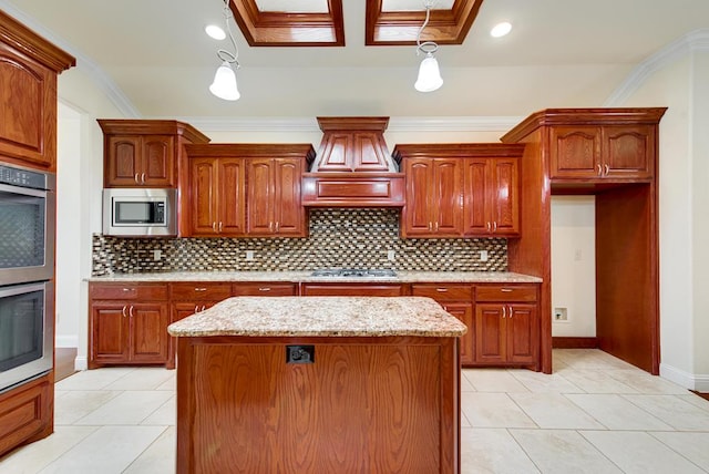 kitchen with a center island, stainless steel appliances, decorative backsplash, ornamental molding, and light stone countertops