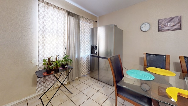 3806 Neely Ave, Midland, TX 79707 - dining area with light tile patterned floors and a textured wall