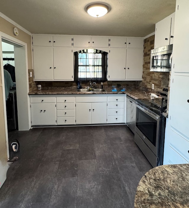 kitchen featuring sink, white cabinetry, a textured ceiling, stainless steel appliances, and decorative backsplash