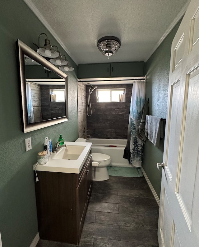 full bathroom featuring shower / tub combo with curtain, vanity, toilet, and a textured ceiling