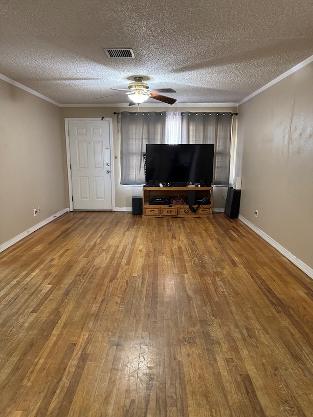 unfurnished living room featuring hardwood / wood-style floors, crown molding, a textured ceiling, and ceiling fan