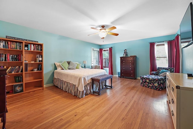 bedroom featuring light hardwood / wood-style floors and ceiling fan