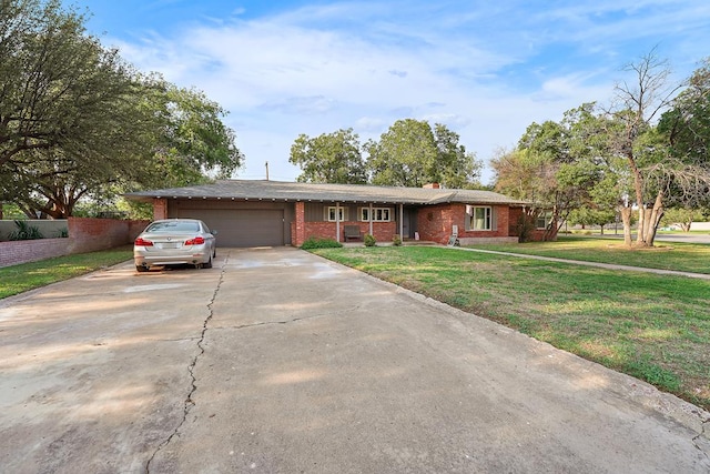 ranch-style house with a garage and a front lawn