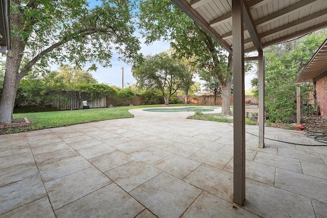 view of patio with a fenced in pool