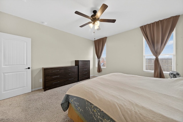 5001 Shadybrook Rd, Midland, TX 79705 - bedroom with light colored carpet, ceiling fan, and baseboards