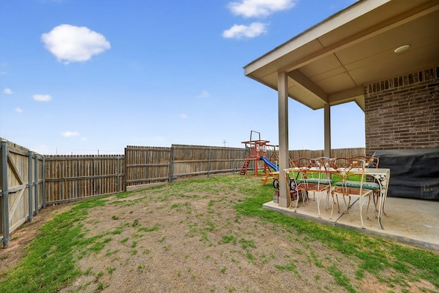 5001 Shadybrook Rd, Midland, TX 79705 - fenced backyard featuring a playground and a patio area