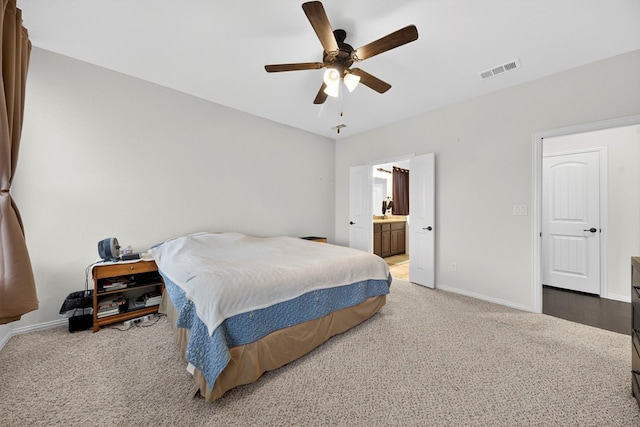 5001 Shadybrook Rd, Midland, TX 79705 - bedroom with light carpet, baseboards, ceiling fan, and ensuite bathroom