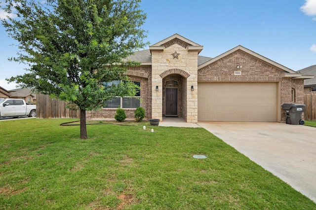 5001 Shadybrook Rd, Midland, TX 79705 - french country inspired facade with brick siding, an attached garage, driveway, and stone siding