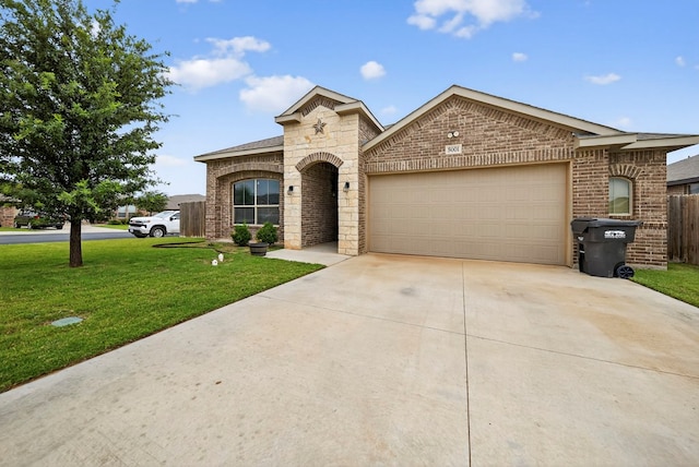 5001 Shadybrook Rd, Midland, TX 79705 - french country style house featuring a garage, concrete driveway, brick siding, and stone siding