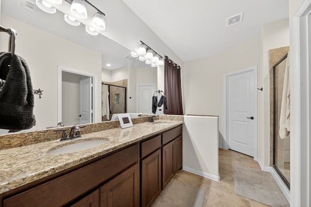 5001 Shadybrook Rd, Midland, TX 79705 - full bathroom with a stall shower, double vanity, baseboards, and tile patterned flooring
