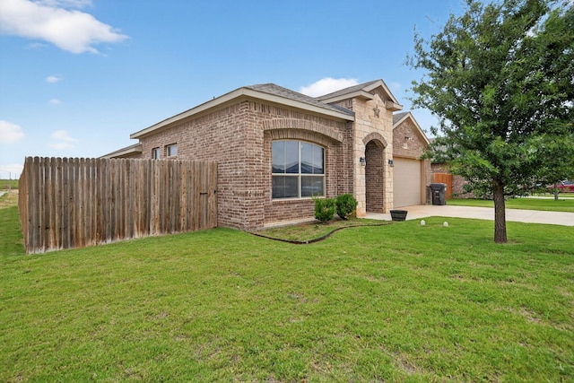 5001 Shadybrook Rd, Midland, TX 79705 - view of front of home with brick siding, a garage, and driveway