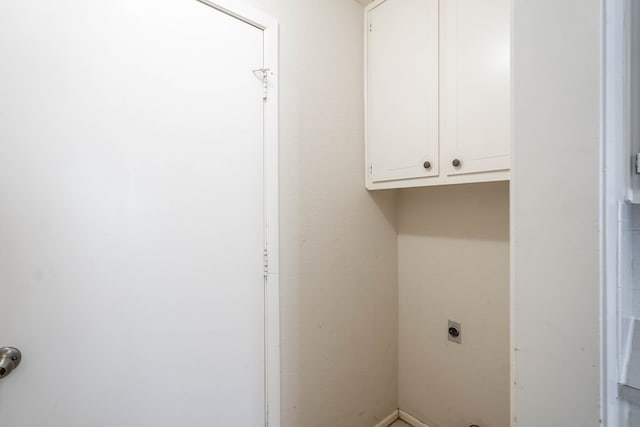 laundry area featuring cabinet space and electric dryer hookup