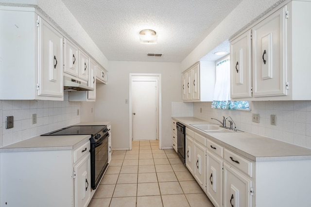 kitchen featuring light countertops, white cabinetry, a sink, under cabinet range hood, and black appliances