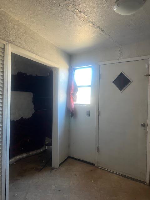 2508 22nd St, Snyder, TX 79549 - interior space with a textured ceiling