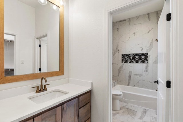 full bathroom featuring vanity, toilet, and tiled shower / bath