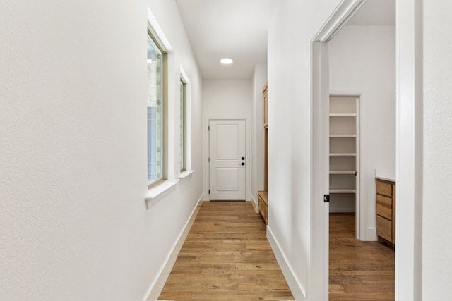 hallway featuring light hardwood / wood-style flooring