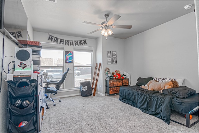 1407 Derrick Ave, Odessa, TX 79765 - bedroom with carpet floors, baseboards, and a ceiling fan