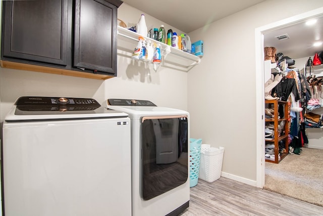 1407 Derrick Ave, Odessa, TX 79765 - laundry room with independent washer and dryer, cabinet space, baseboards, and light wood-style floors