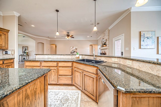 kitchen featuring dishwasher, hanging light fixtures, light tile patterned floors, ceiling fan, and sink