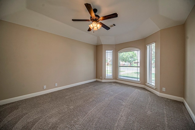 carpeted empty room with ceiling fan and lofted ceiling