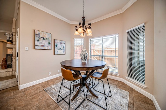 dining area featuring ornamental molding and a chandelier