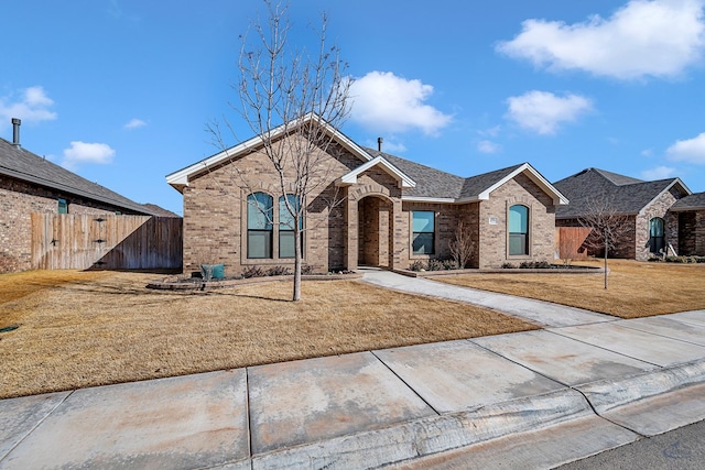 ranch-style house with a front yard