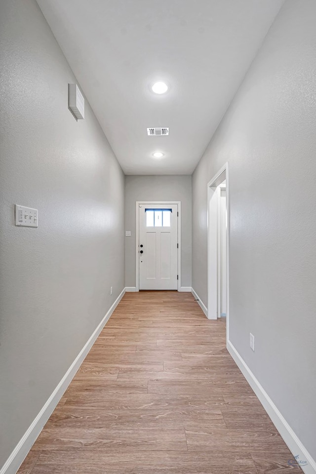 doorway with light hardwood / wood-style floors