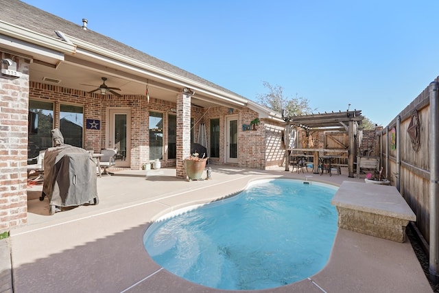 view of pool featuring a patio area, a pergola, and ceiling fan