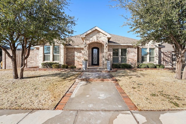 view of front of property with a front lawn