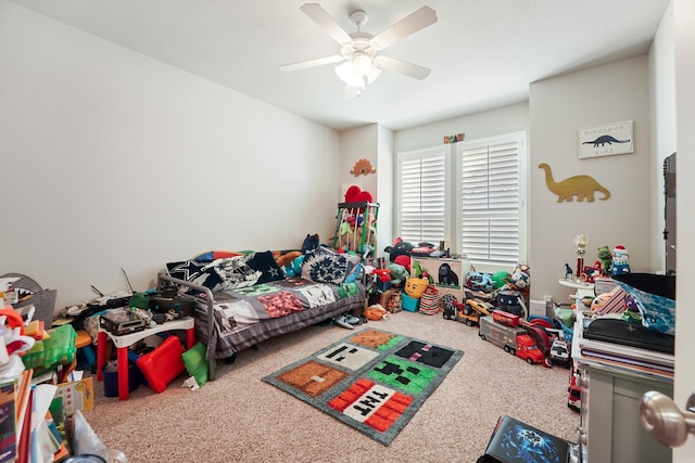 playroom featuring ceiling fan and carpet