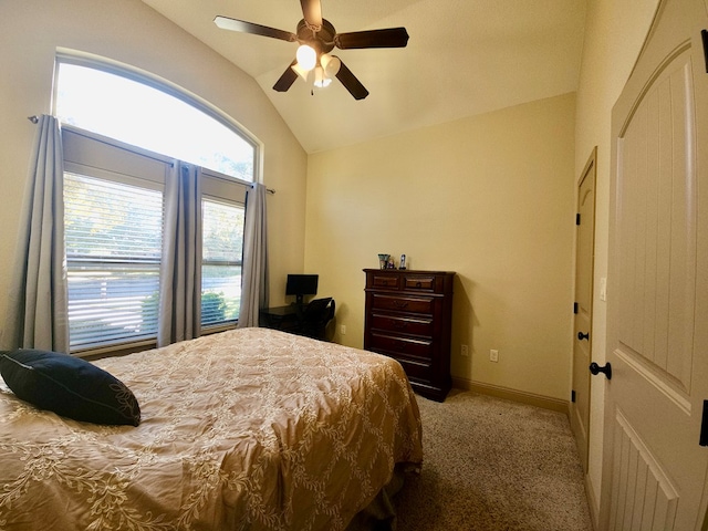 bedroom featuring ceiling fan, light carpet, and vaulted ceiling