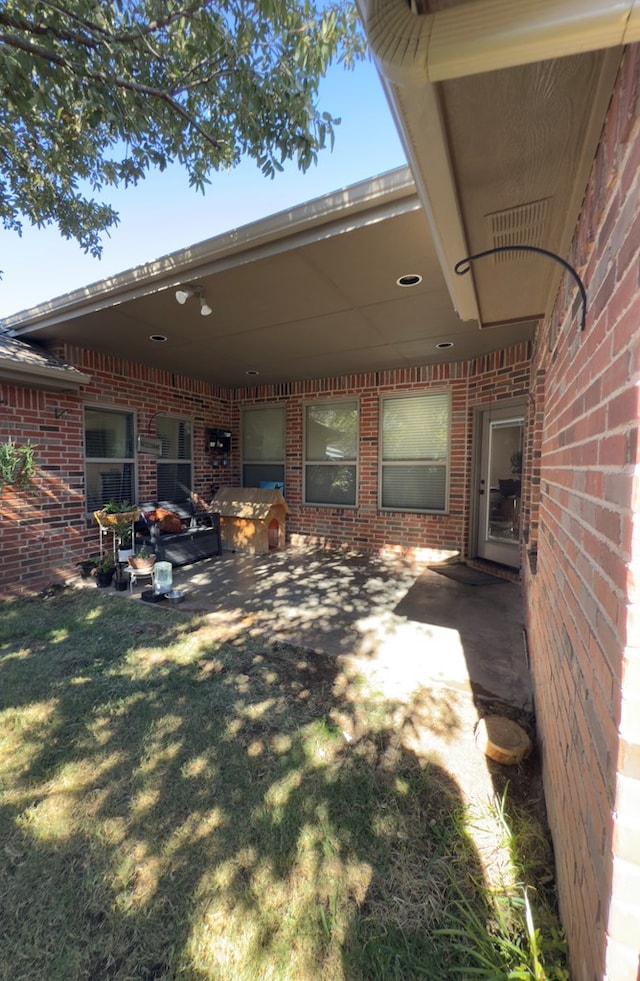 exterior space with a yard and a patio