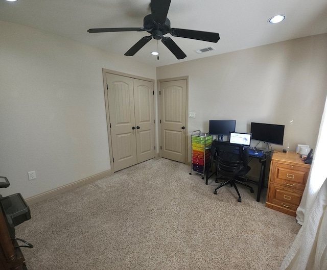 carpeted home office with ceiling fan