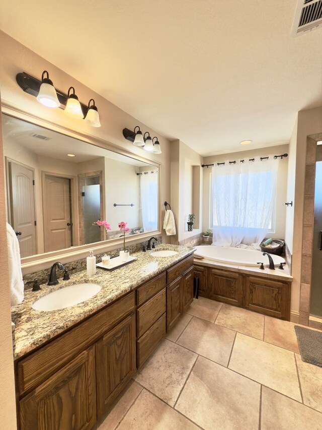 bathroom with a bath and vanity