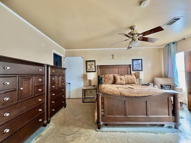 bedroom featuring ceiling fan and crown molding