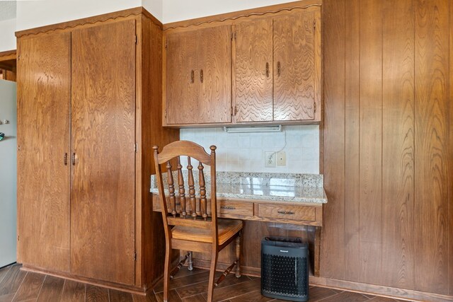 dining area featuring dark wood-type flooring