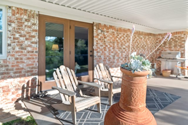 view of patio / terrace featuring french doors and a grill