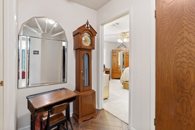 hallway featuring a textured ceiling