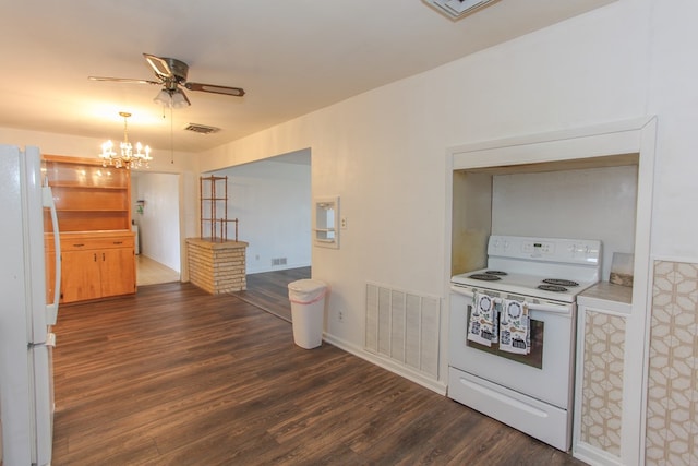 kitchen with dark hardwood / wood-style flooring, ceiling fan with notable chandelier, and white appliances