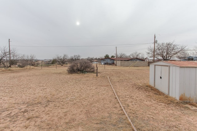 view of yard with a shed